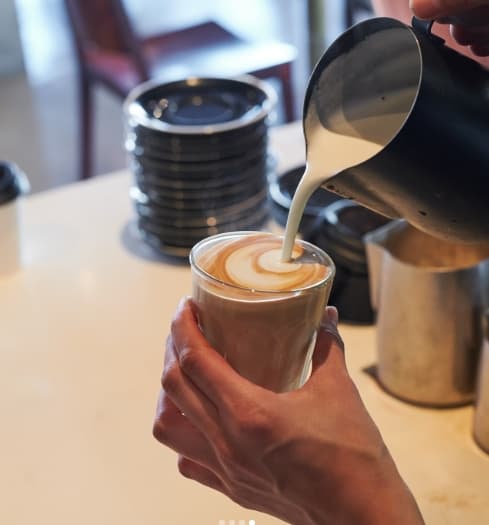 Latte art poured by our barista at Niche on bridge café, Richmond