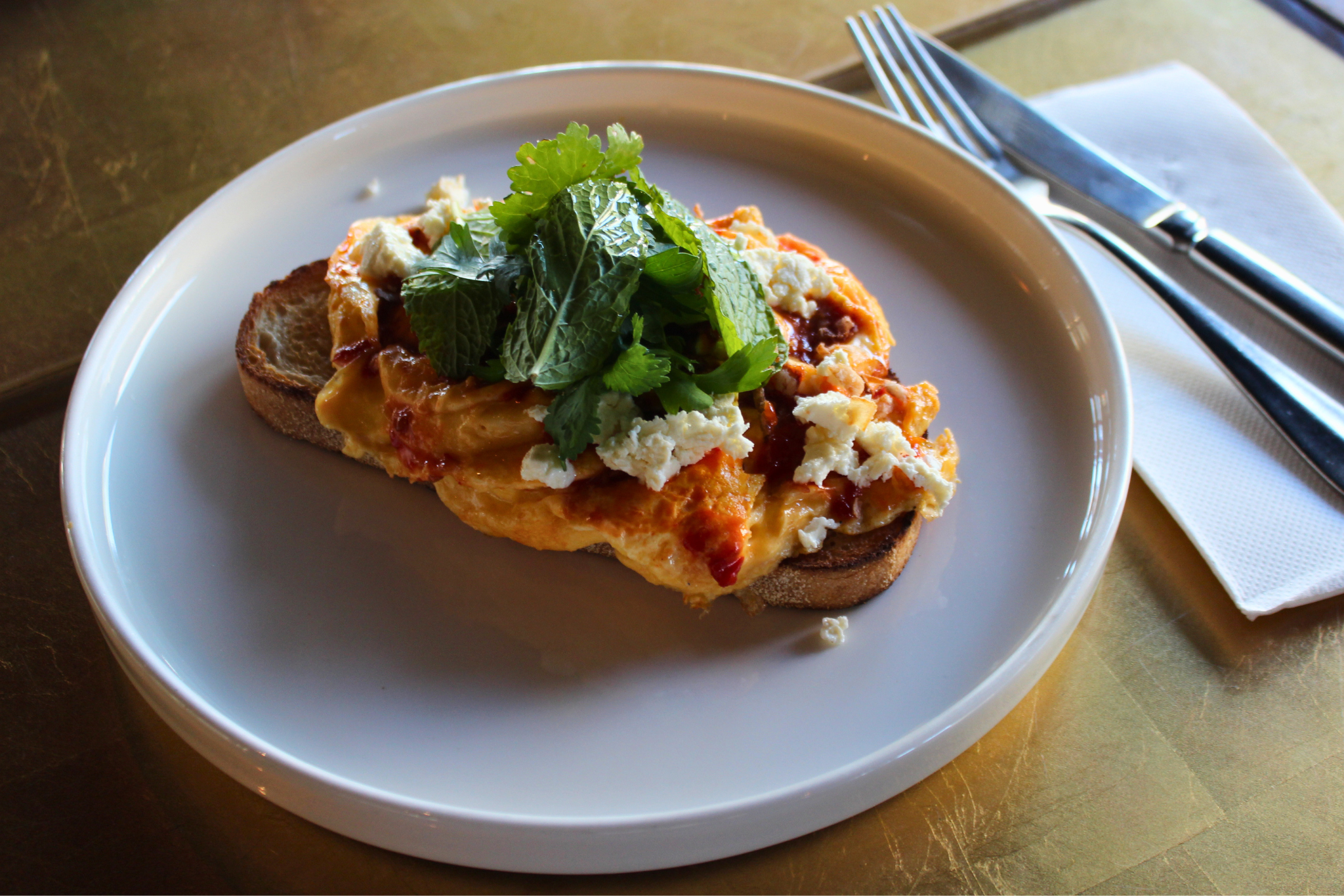 Sourdough with scrambled eggs at Niche on bridge café, Richmond